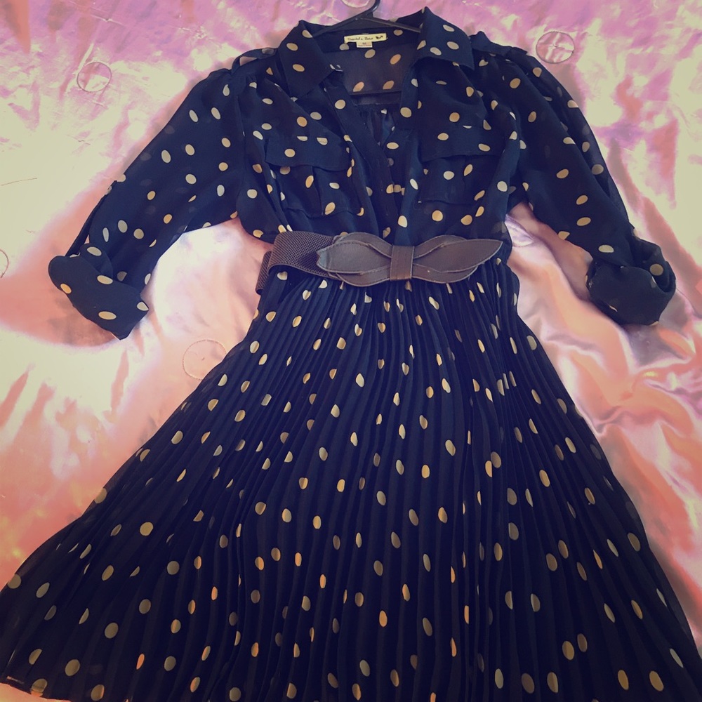 Cute polka dot dress with belt.